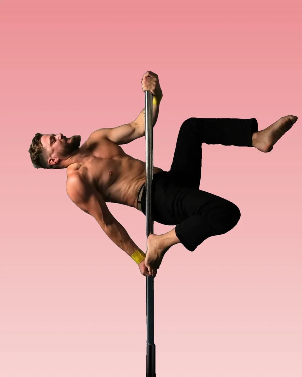 Pole athlete holding a strong side pose, wearing a yellow SneakyDeez wrist wrap